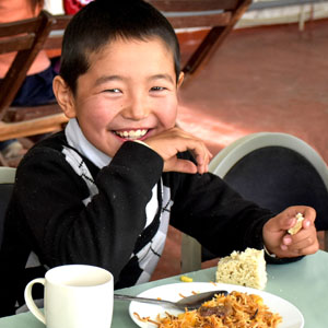 Boy smiling at lunch