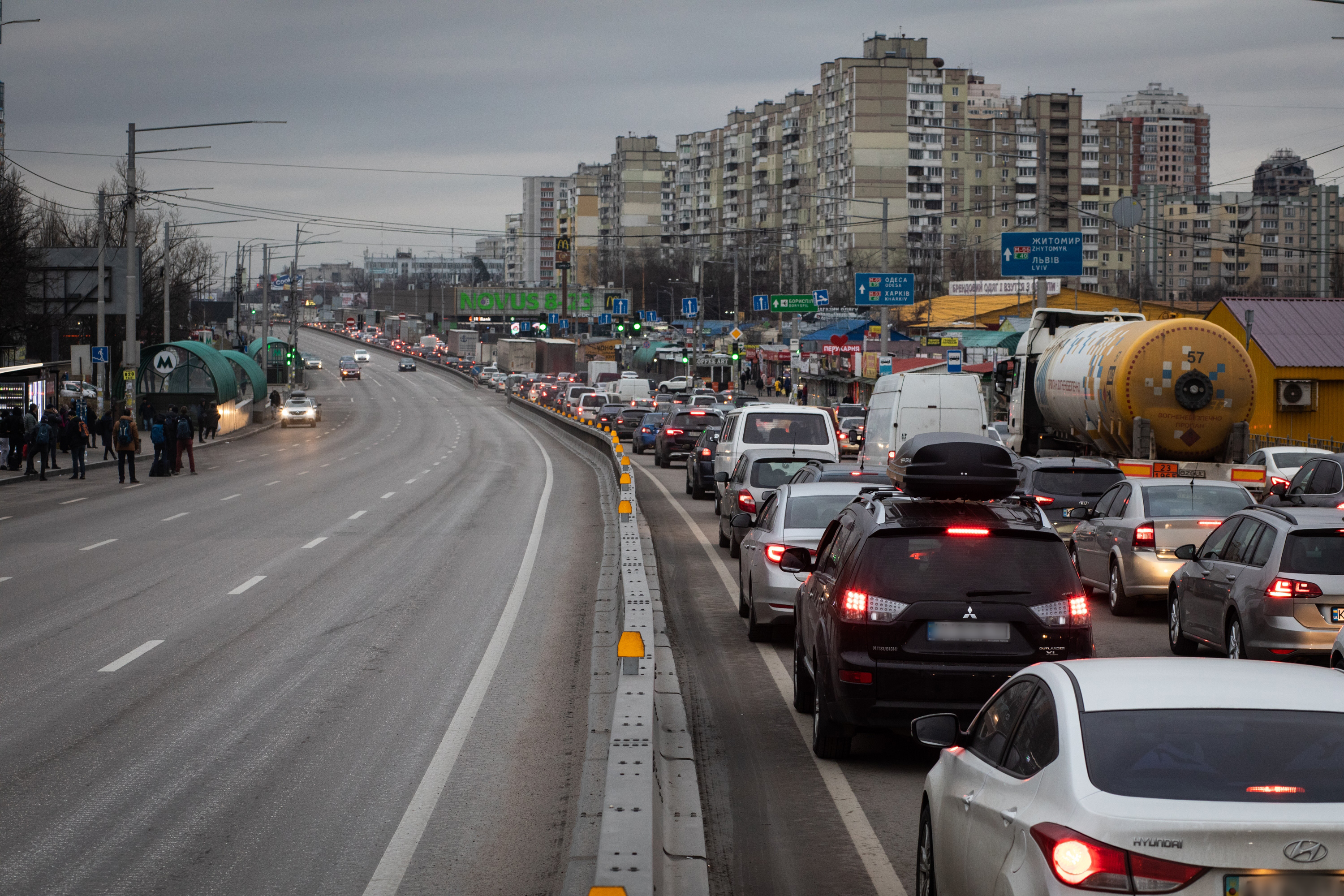 Residents and truck drivers seeking to leave the capital in a traffic jam in Kyiv, Ukraine. Photo credit: Erin Trieb/Bloomberg via Getty Images