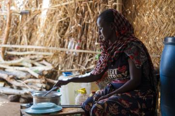 A person cooking food.