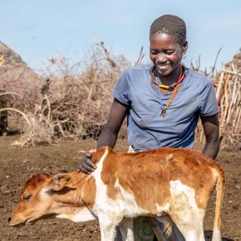 A person with their farm animal.