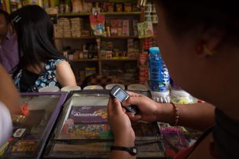 An adult uses a mobile device. 