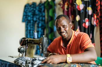 A person using a sewing machine.