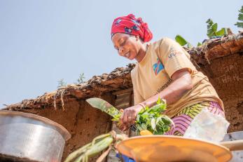 A woman prepares food in the democratic republic of congo.