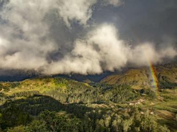 Rainbows forming over the rugged mountains of timor-leste.